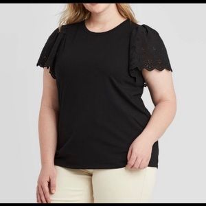 Eyelet flutter sleeve black top